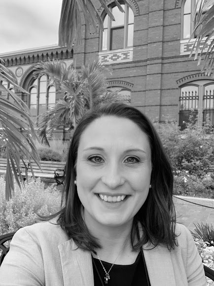 Caitlin Haynes, sitting in front of the Smithsonian's Arts and Industries Building in Washington, DC