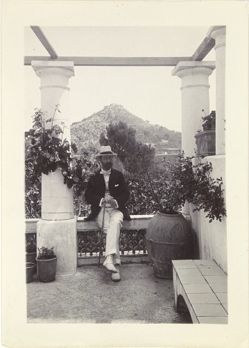 A very dapper Charles Lang Freer sits cross-legged on a veranda in Capri.